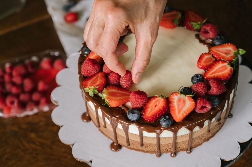 Chocolate drip cake topped with strawberries