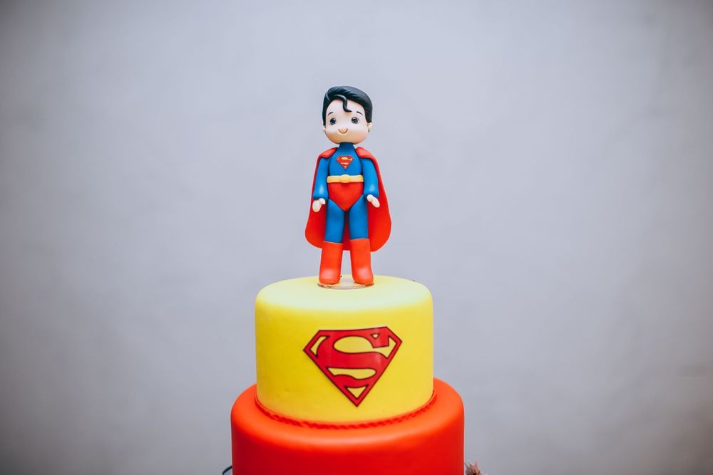 Superhero theme cake with a fondant figure