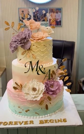 Two-tier ombre wedding cake with sugar peonies and gold leaves, made by MOJO CAKES